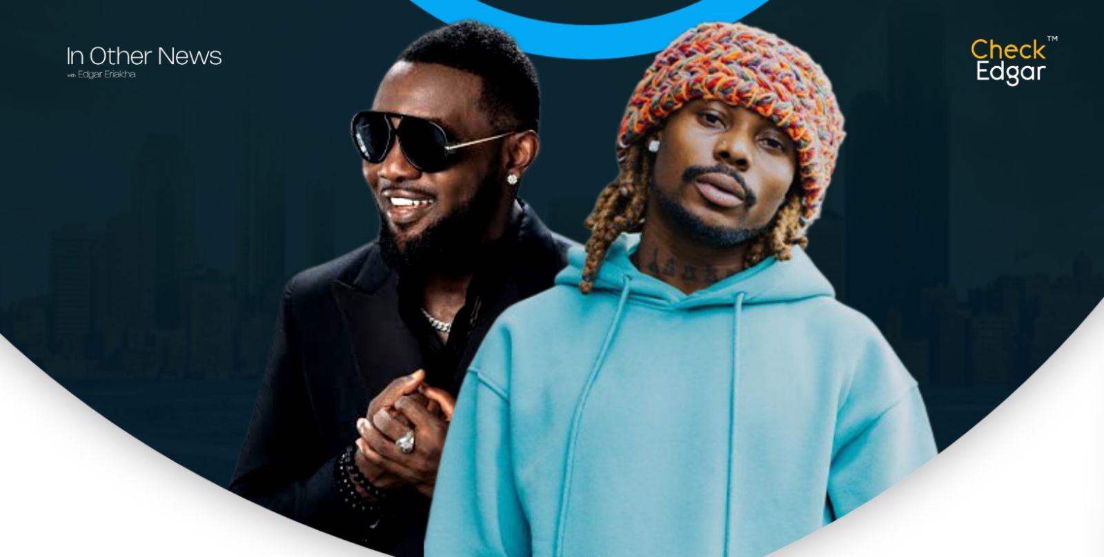 AY and Asake posing for a photo, AY in sunglasses and a black suit, Asake in a blue hoodie with a colorful beanie.