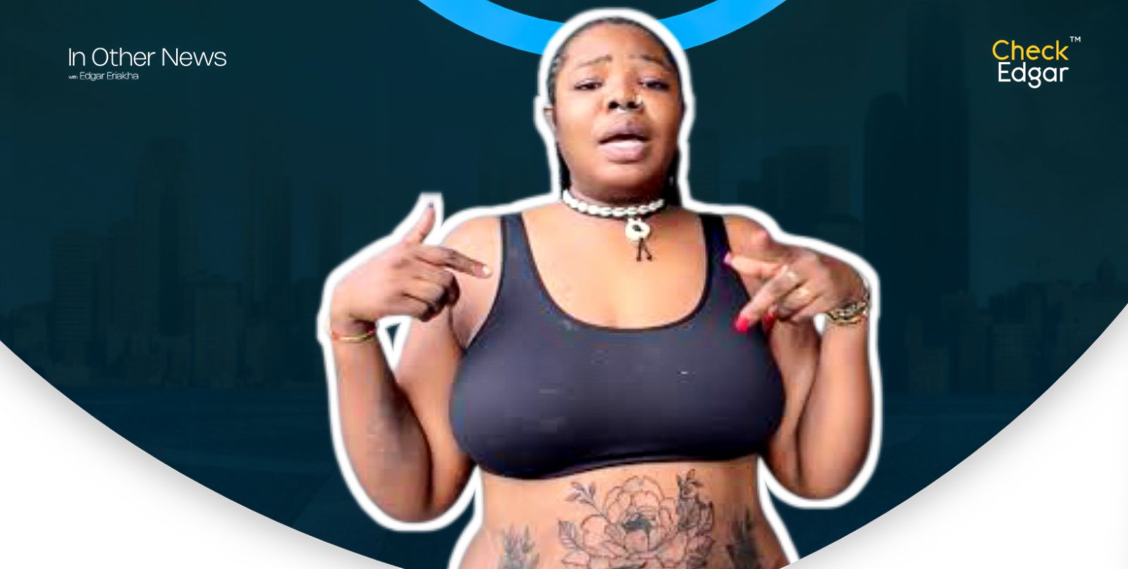 Judas the Bead Maker showcases her tattoo while wearing a black tank top and necklace.