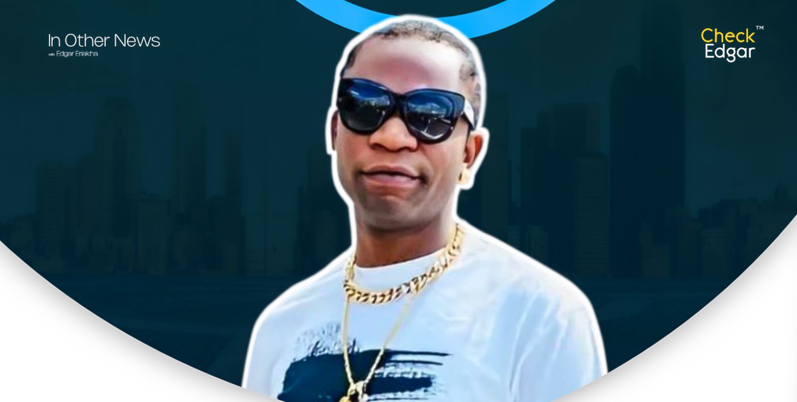 Speed Darlington wearing sunglasses and a white t-shirt.