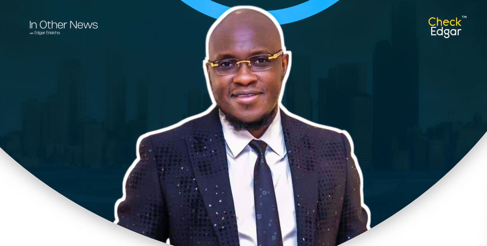 Portrait of Pastor Tobi Adegboyega wearing glasses and a sparkly black suit.