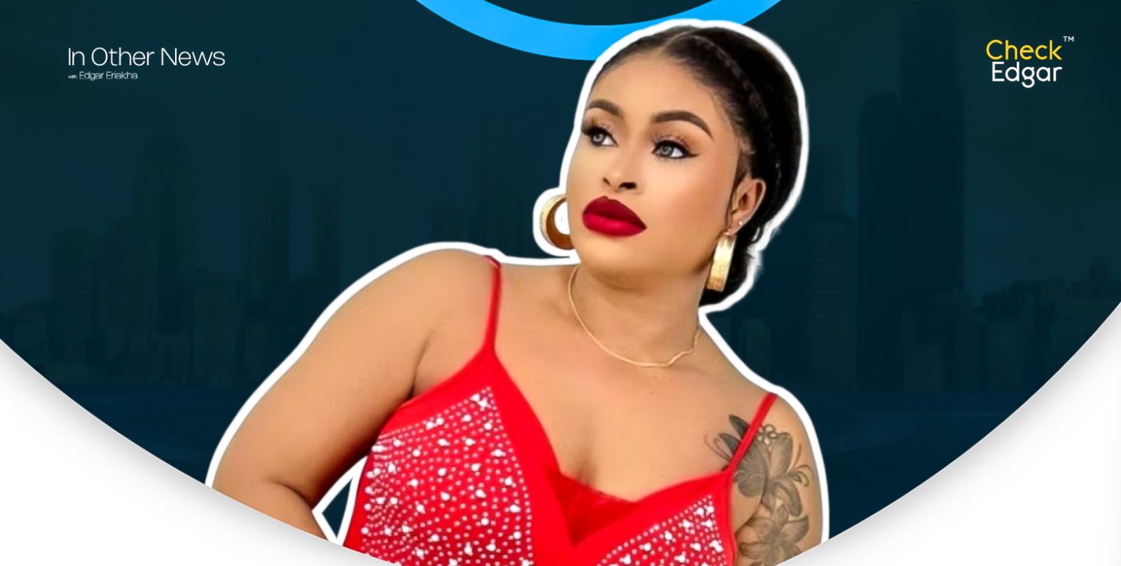 Sarah Martins with bold makeup and red lipstick poses in a red top with embellishments.