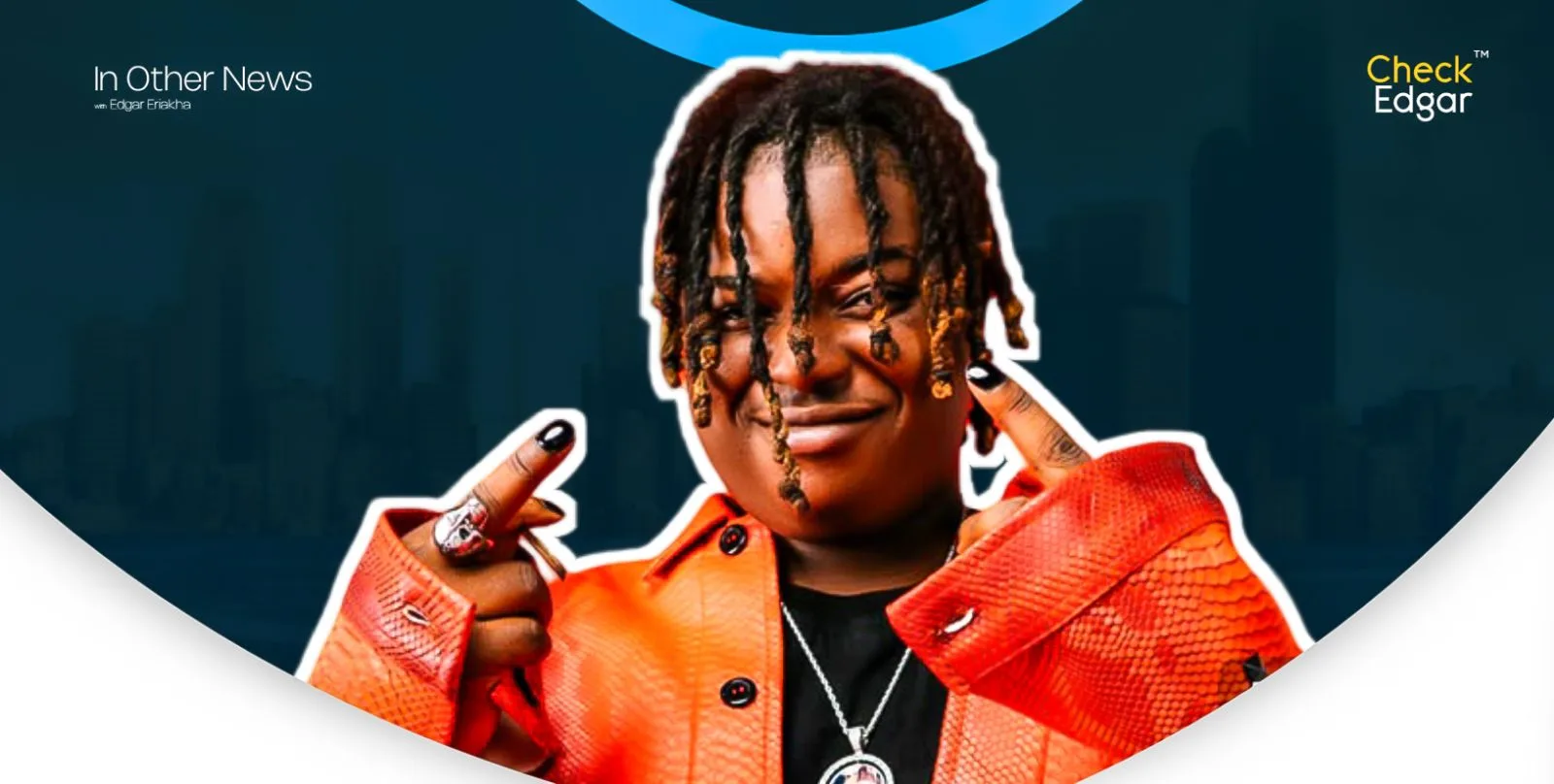 Barry Jhay in an orange jacket with long hair showing a playful gesture.
