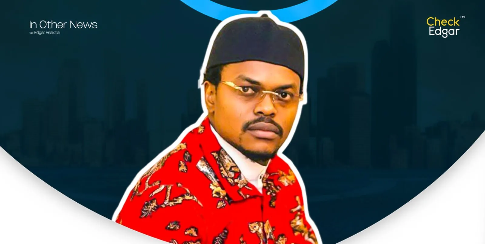 Blord in a red patterned shirt with glasses and a black cap.