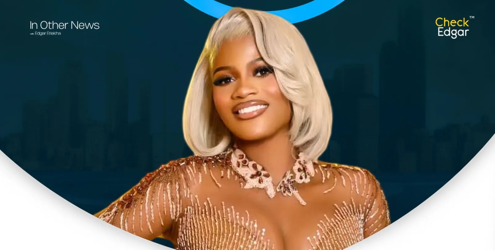 Irewole with platinum blonde hair smiles, wearing a sparkling outfit with intricate details.