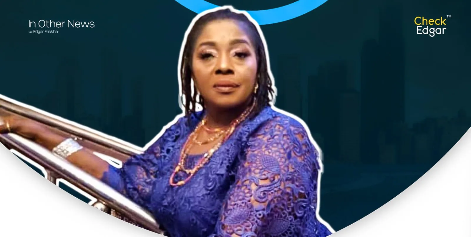 Rita Edochie looks directly at the camera, wearing a blue lace outfit.