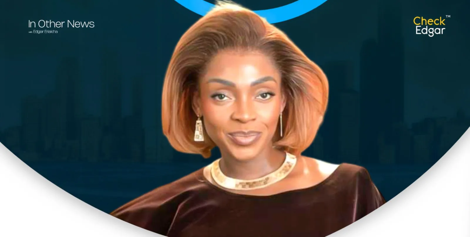 A close-up of Sharon Adeleke smiling, wearing earrings and a necklace.