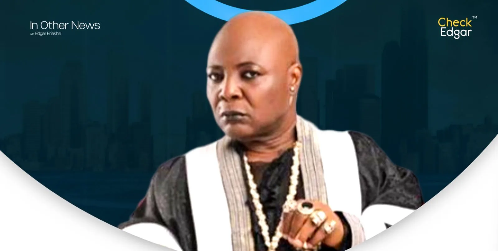 Charly Boy wearing traditional attire and jewellery, looking serious.