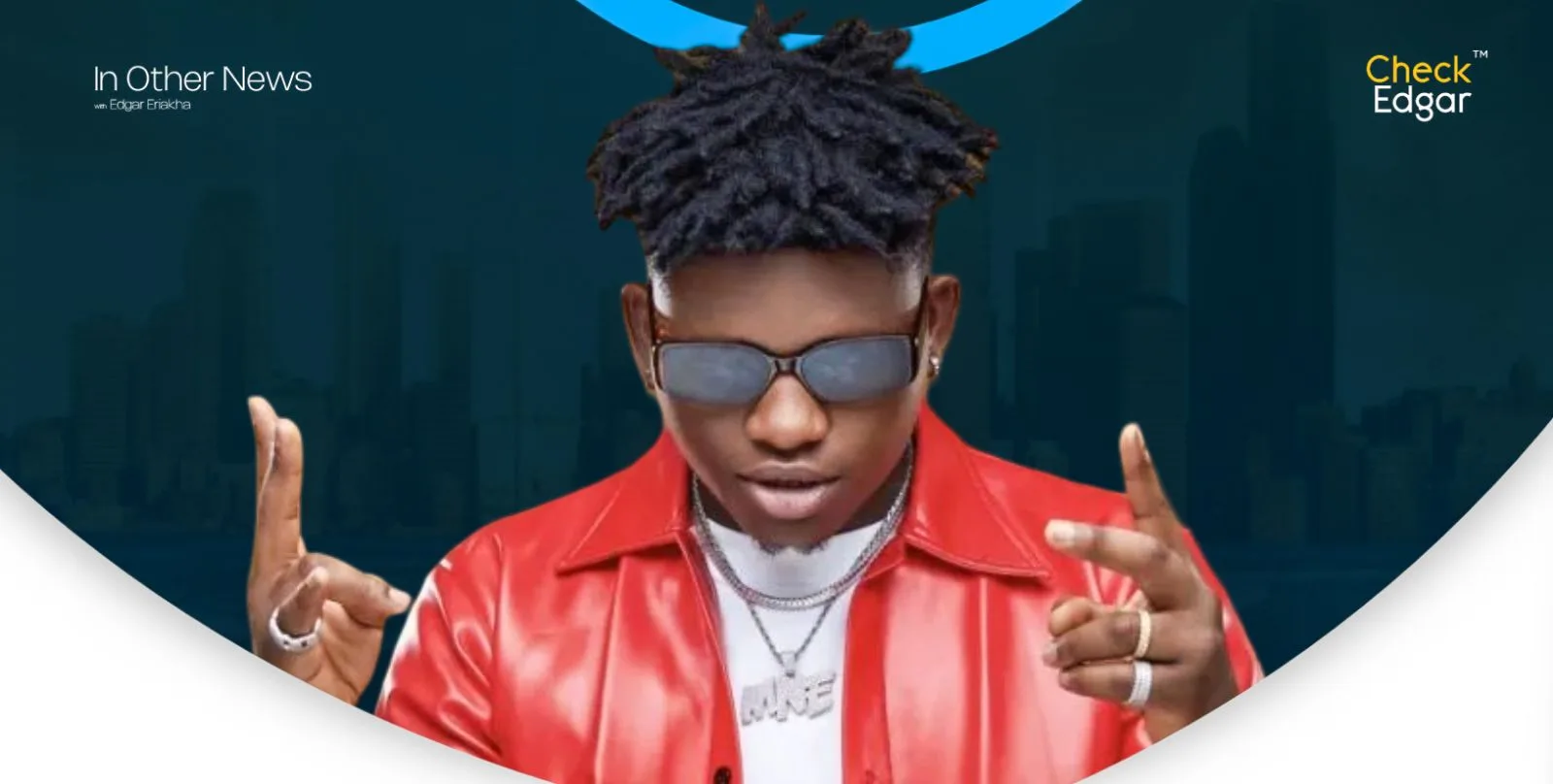 Close-up of T Classic with dreadlocks in sunglasses, wearing a red jacket.