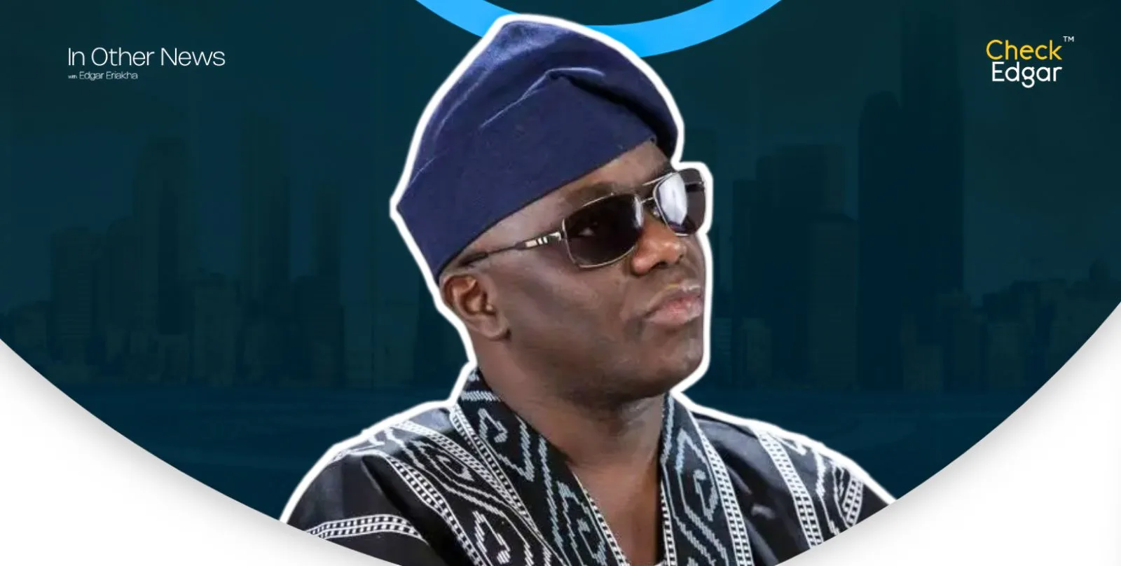Ayo Animashaun  in a traditional outfit and sunglasses.