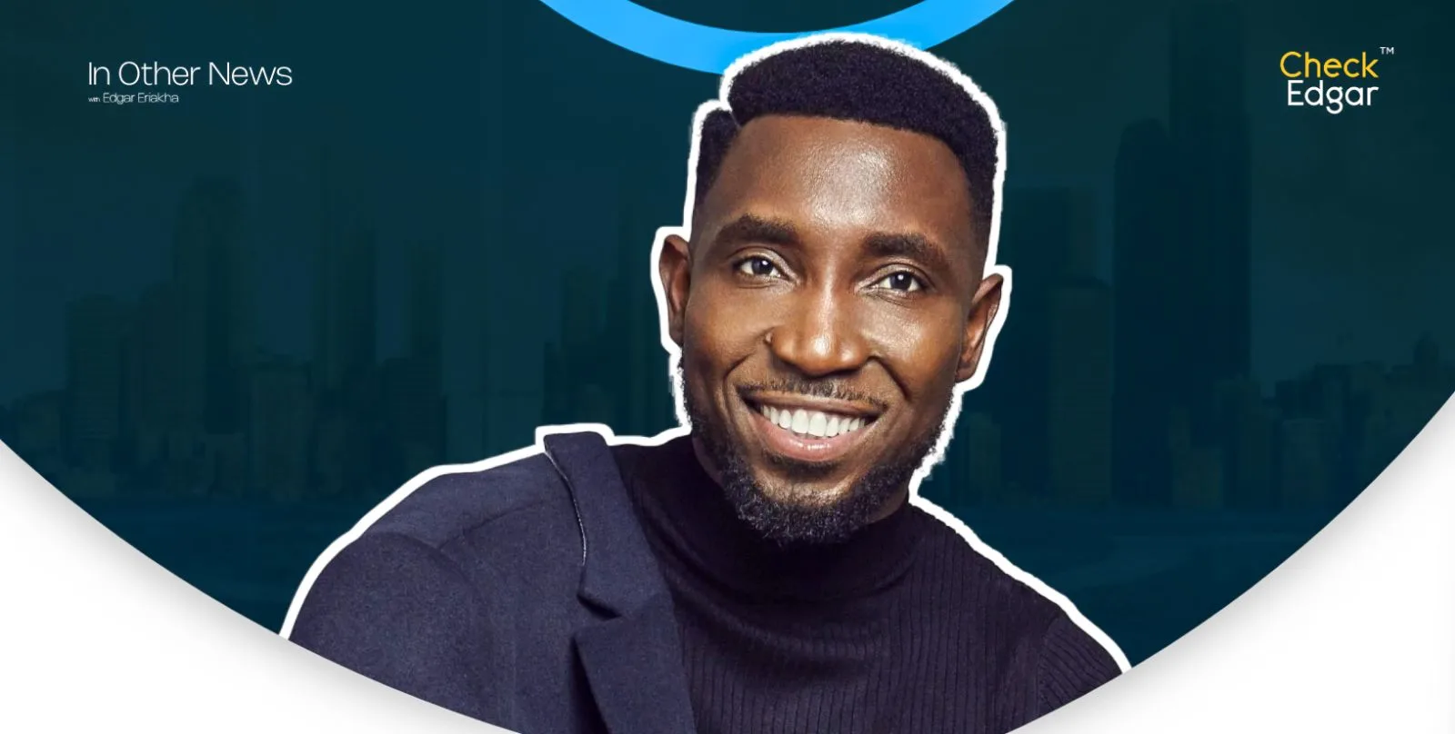 Timi Dakolo with a bright smile wearing a black turtleneck and blue blazer.