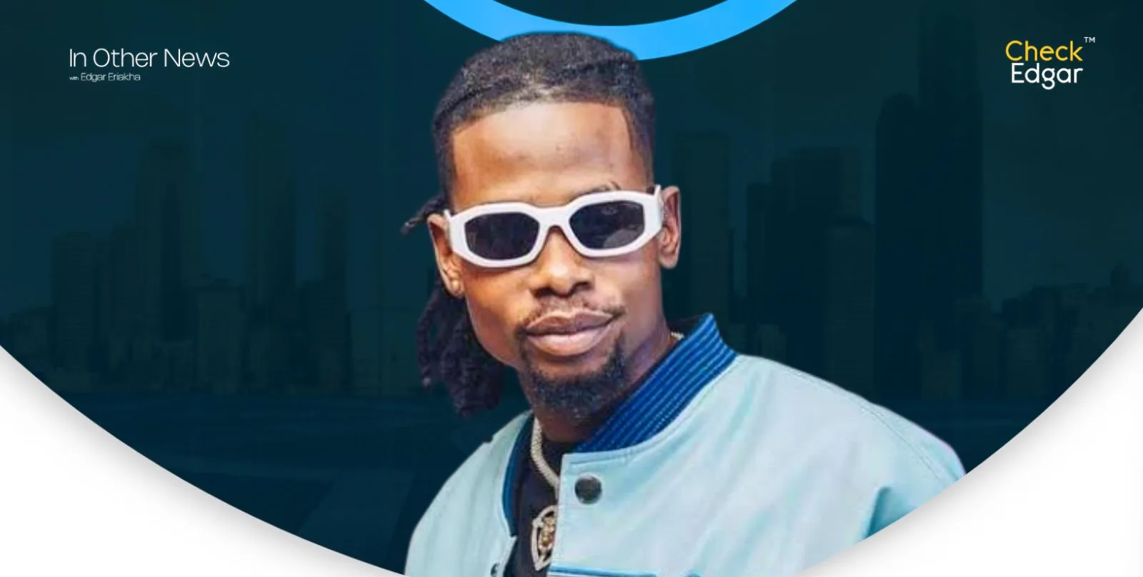  Yhemo Lee in a blue bomber jacket smiles, showcasing his sunglasses.