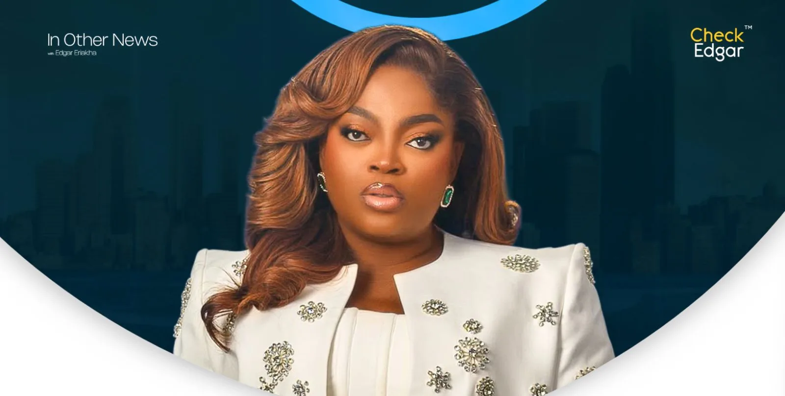 Funke Akindele with long hair wearing a stylish white outfit with embellishments.