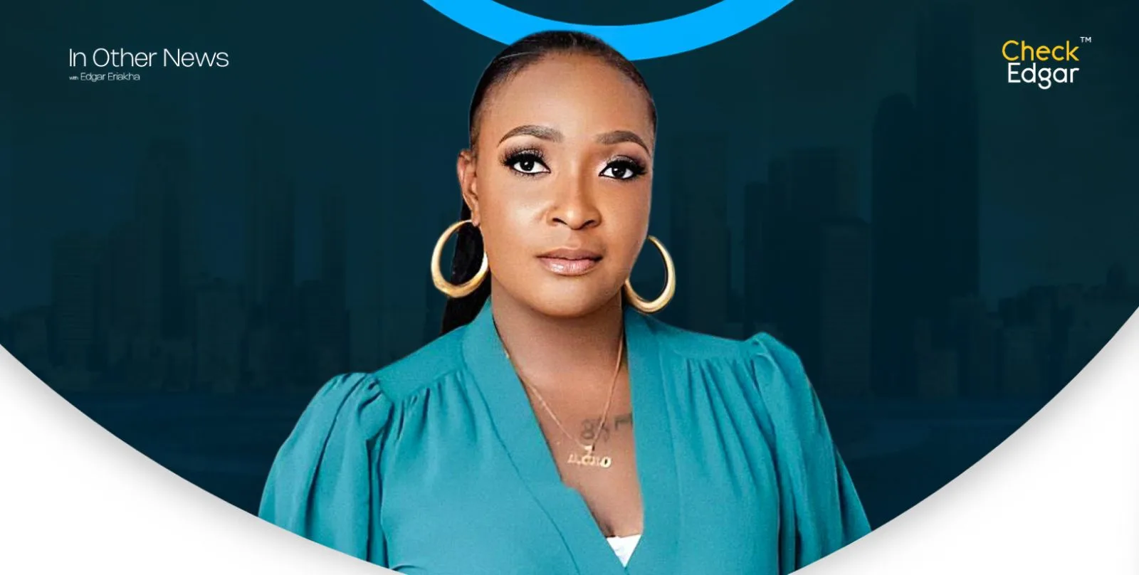 Close-up of Blessing CEO with long hair and hoop earrings, wearing a turquoise blouse.