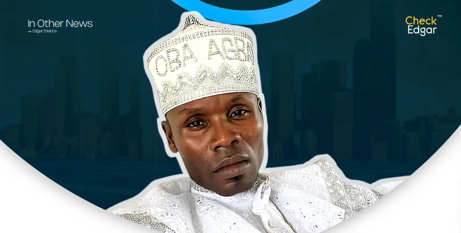 Close-up of OBA Solomon wearing a white embroidered cap and attire, with a neutral expression.