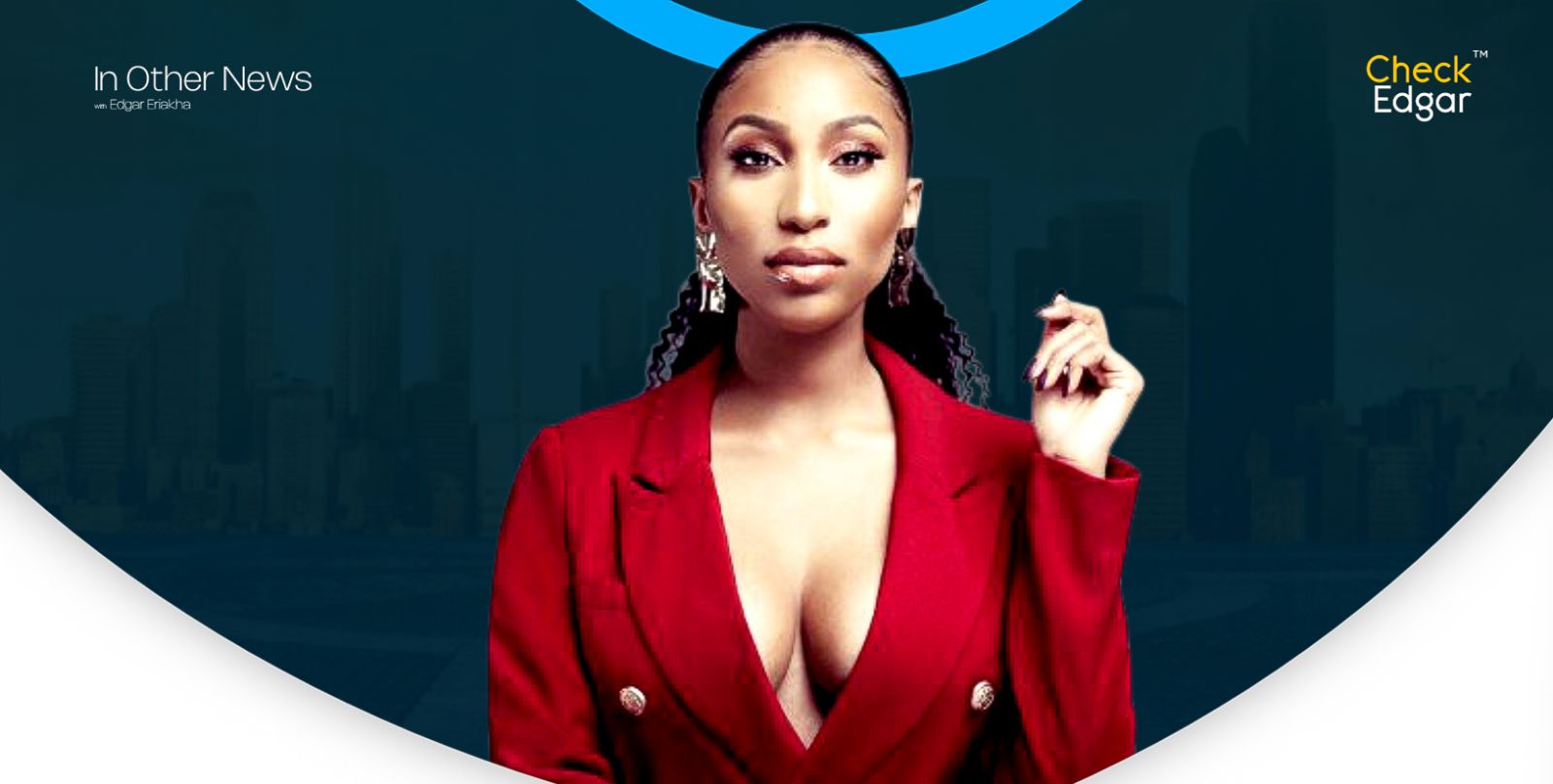 Toni Tone with sleek hair and bold makeup stands with an assertive expression.