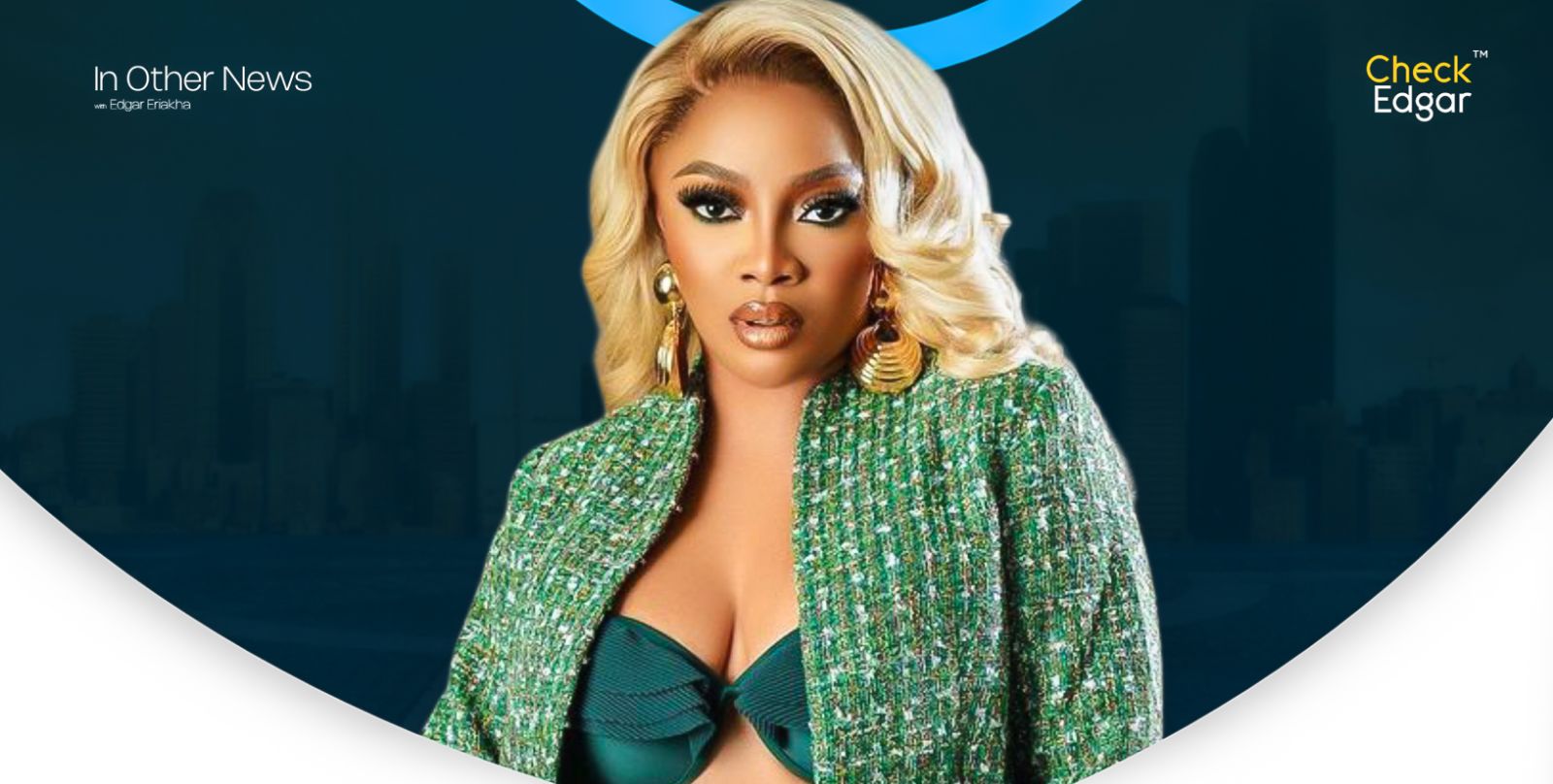 Toke Makinwa with long blonde hair poses in a green textured jacket and teal top, looking confidently at the camera.