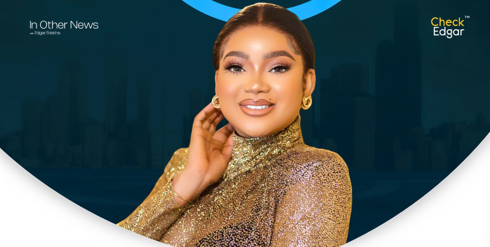 Rachael Okonwo in a sparkling gold top smiles while touching her neck.