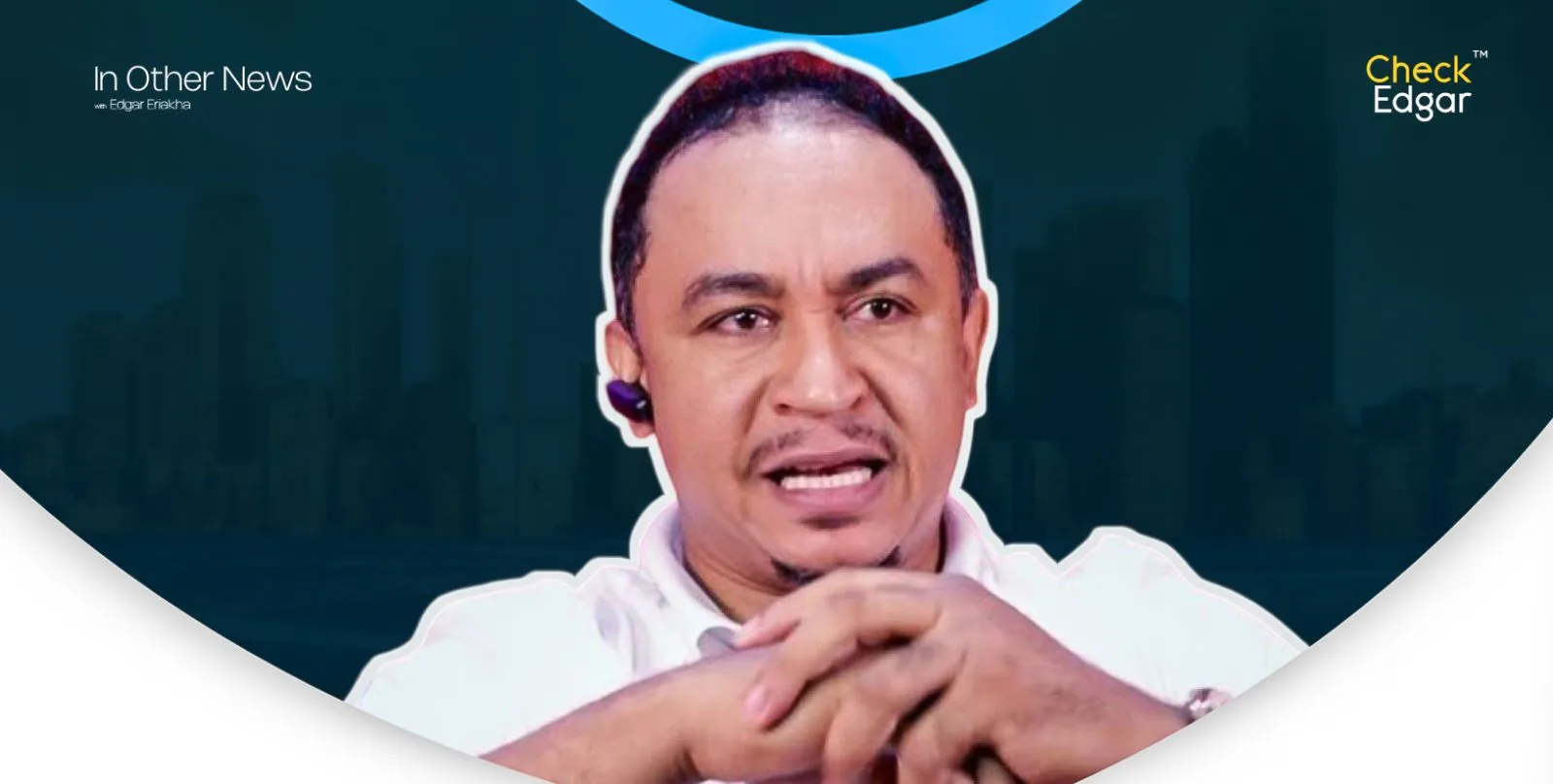 Close-up of Daddy Freeze with a serious expression and hands clasped.