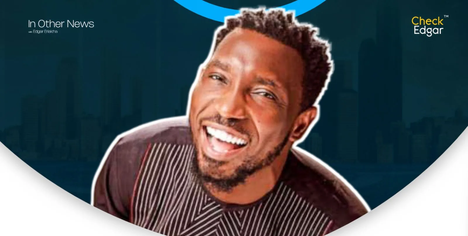 Timi Dakolo with curly hair smiling broadly in a patterned shirt.