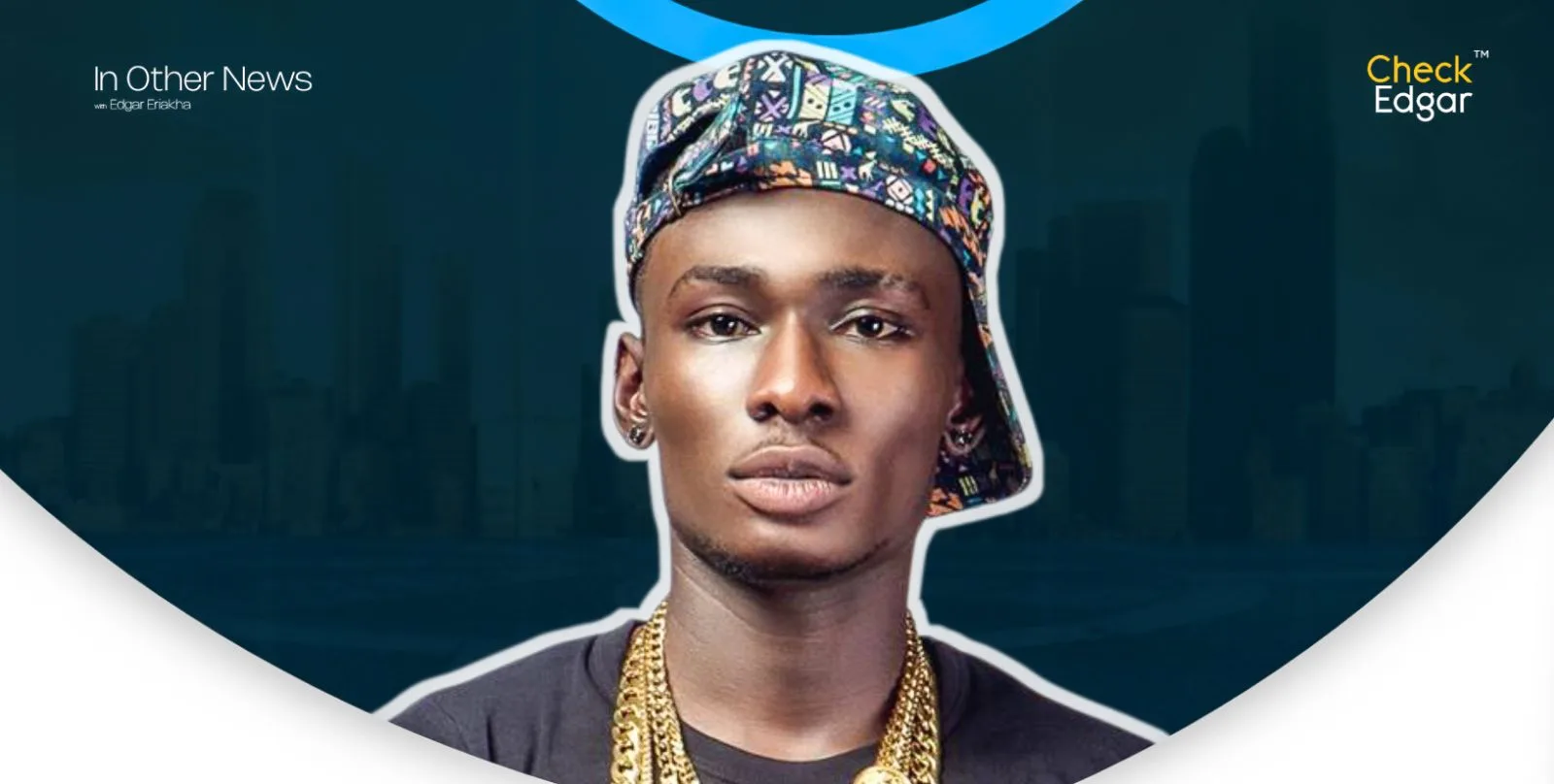 Phenom with a patterned cap and gold chains poses for the camera.