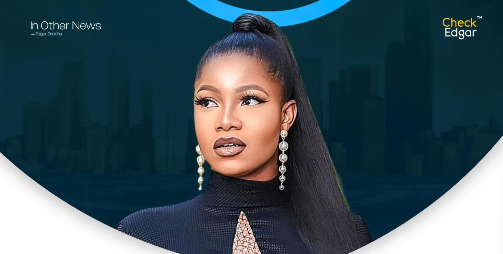 Tacha with long hair styled in a ponytail, wearing statement earrings and a black outfit, gazes thoughtfully.