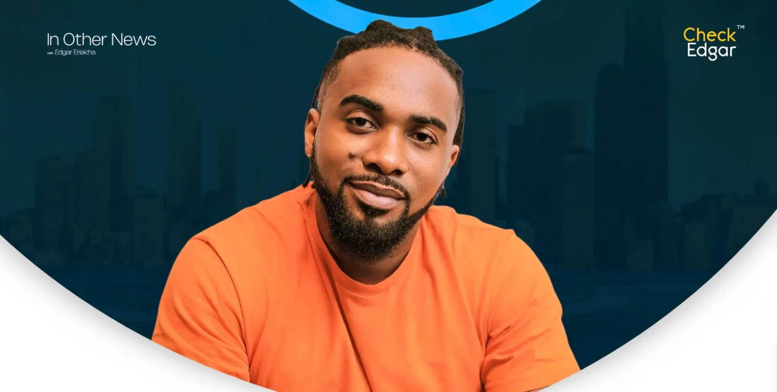 Portrait of Uzor Arukwe with braided hair and a beard, wearing an orange top.